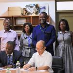 Professor Gabriel Dwomoh, Vice Chancellor of Kumasi Technical University (left), and Professor Su Zibo, Chinese Director of the Confucius Institute at KNUST (right), sign the Memorandum of Understanding to establish a Teaching Centre at KsTU, 