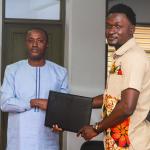 Prof. Gabriel Dwomoh (left) and Mr. Christopher Adu Gyamfi, CEO of Chafas present the signed Memorandum of Understanding (MoU) document in a group photo. 